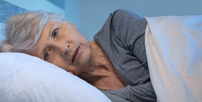 Elderly woman experiencing grief, having trouble sleeping